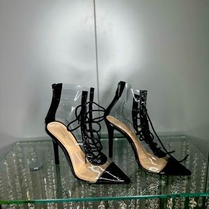 Beautiful black and clear tie woman boots. Size 9 but fits a size 8 better.